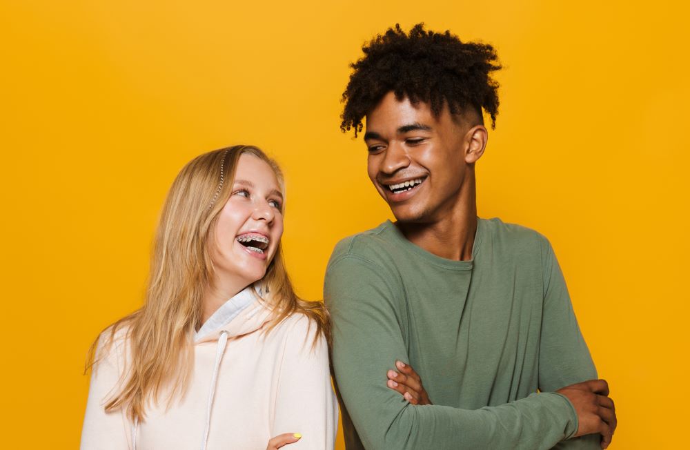 A picture of two teenagers in braces